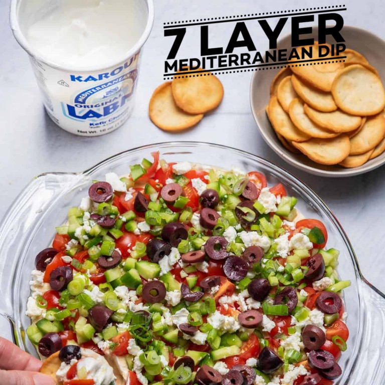7 Layer Mediterranean Dip title on salad image