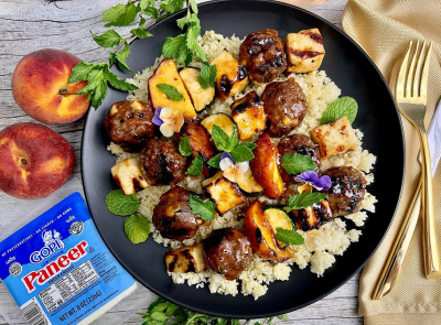 Glazed Lamb Meatball, Paneer, Peach, And Zucchini Skewers Over Couscous