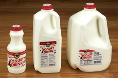 3 different size milk jugs of Karoun Yogurt Drink